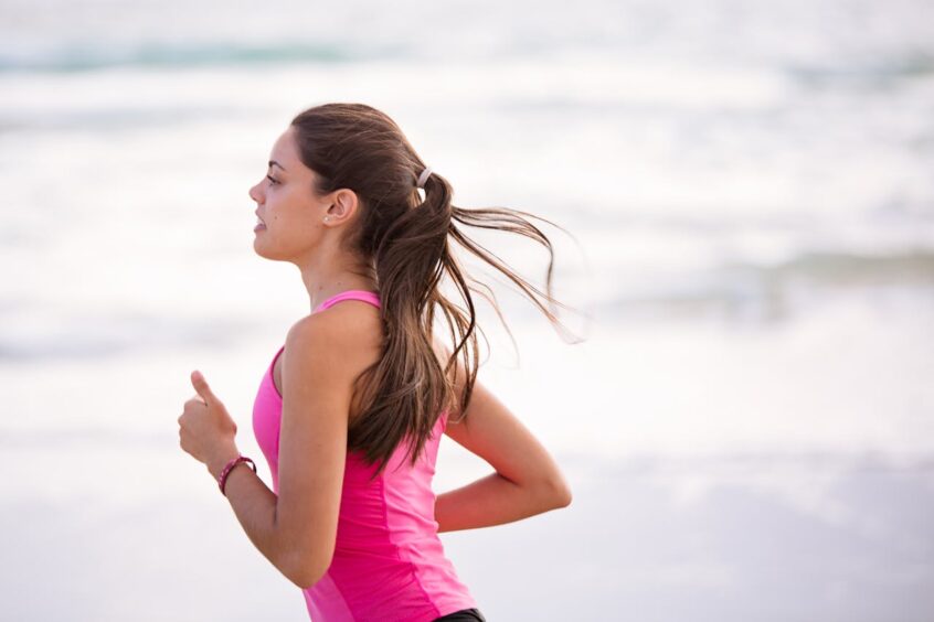 Woman running on beach