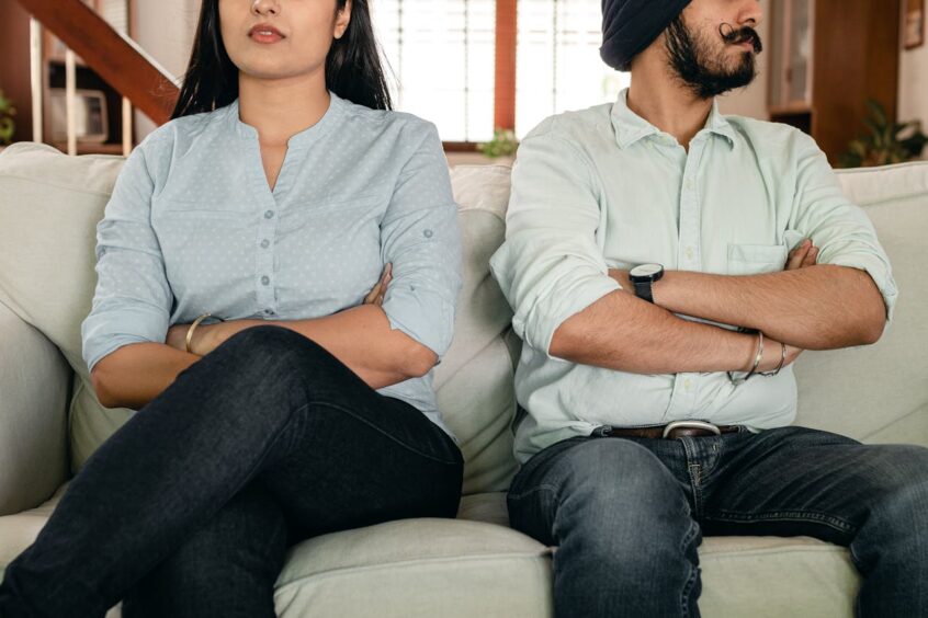 Couple on couch with marriage issues