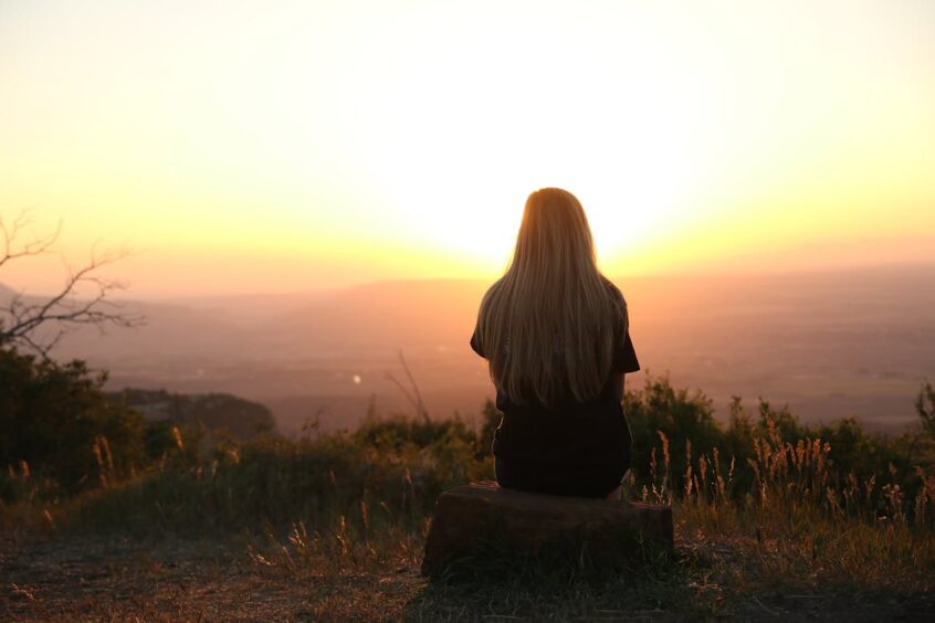 Woman looking at sunset